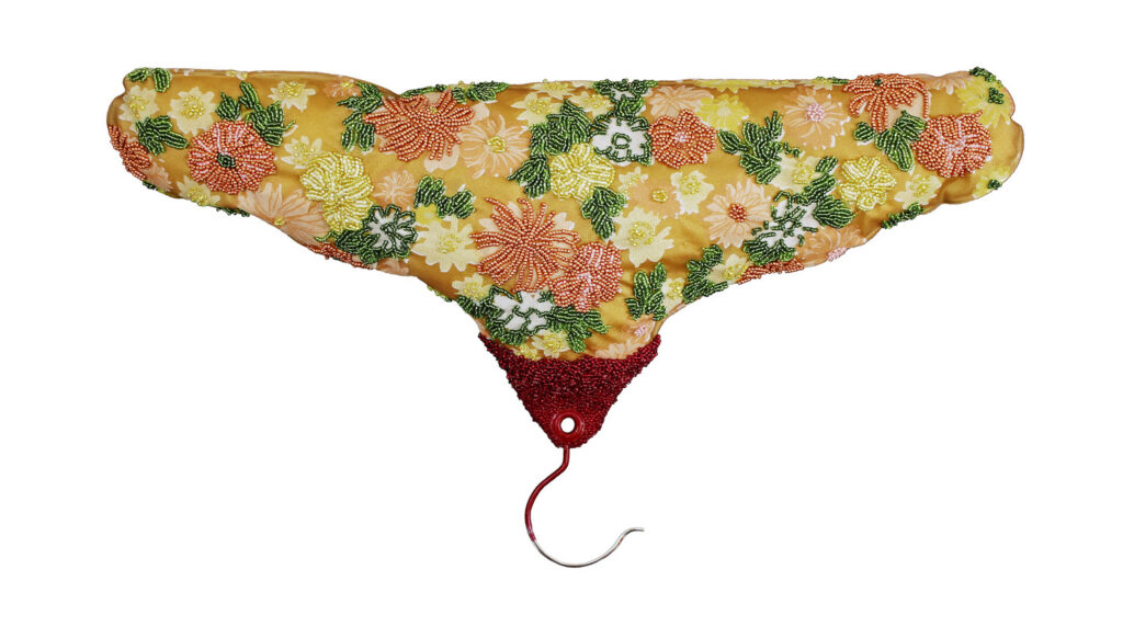 Holly Ballard Martz, Women's work is never done (gilded age); vintage inflatable hanger, glass seed beads, thread, polyfil; 11" x 19"x 2.5"; 2019; Artist